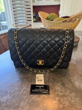 CHANEL Maxi Classic Double Flap Caviar Bag with Gold Hardware